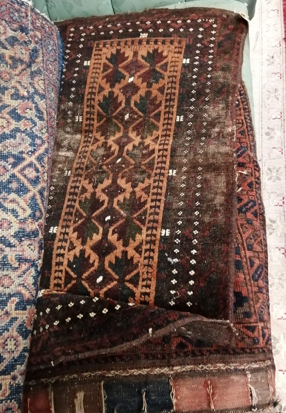 Six antique Belouch bags and faces, largest 200 x 52cm